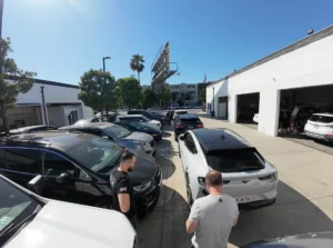 CarVive Collision Center lot with multiple vehicles being inspected in Los Angeles