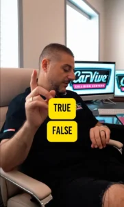 CarVive technician explaining collision repair myths with a TRUE/FALSE card